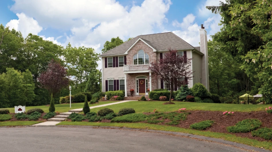 A stock photo of a house in the suburbs